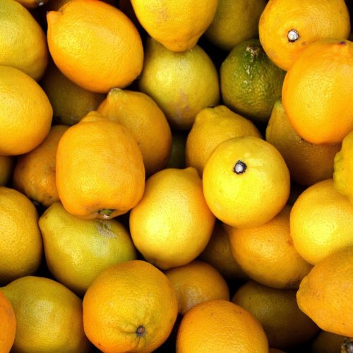 A vibrant close-up of fresh, juicy lemons perfect for healthy diets and vitamin C boost.